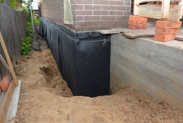 Happy homeowners after waterproofing job in Schoolcraft